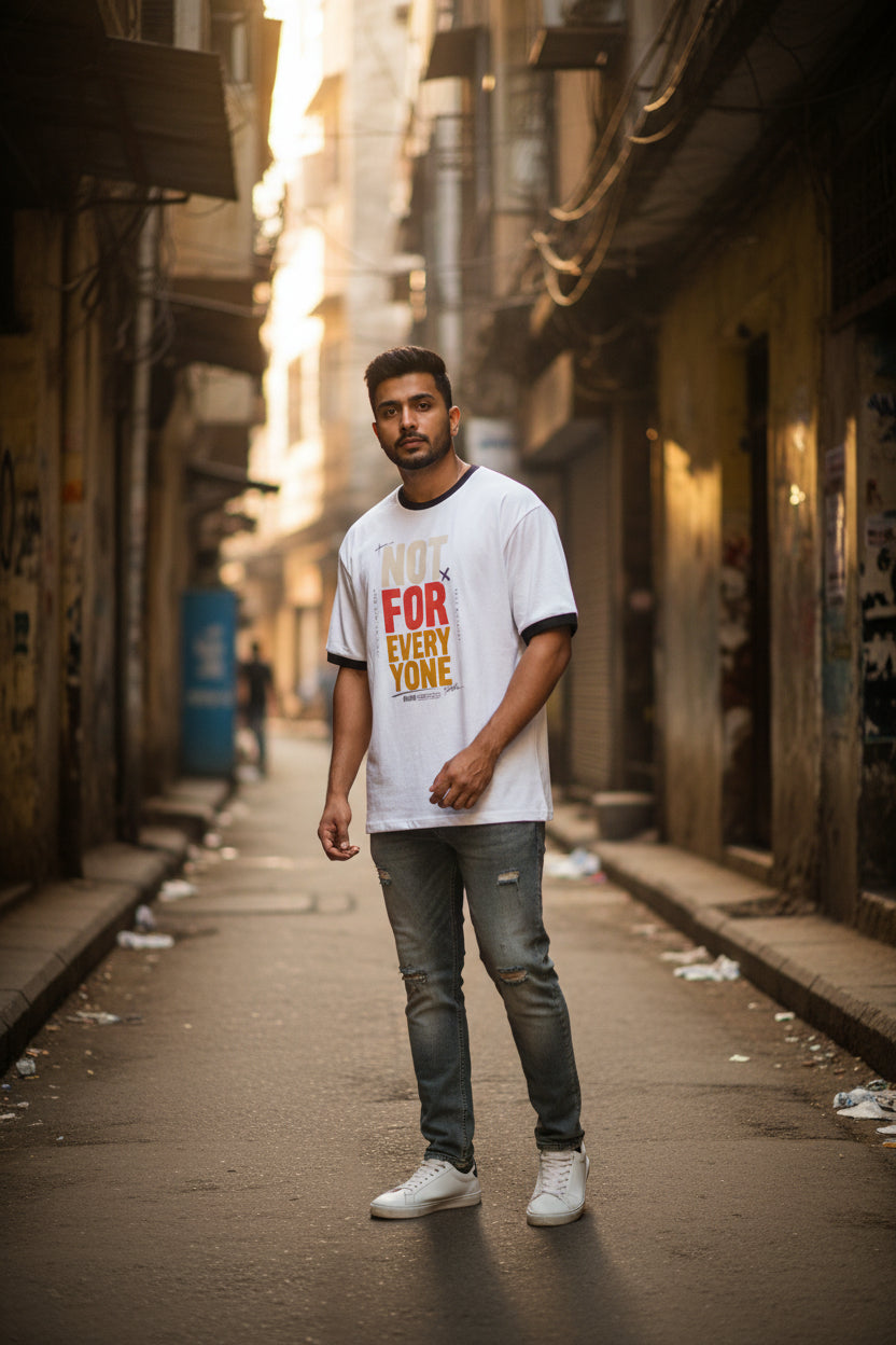 White t-shirt with colorful text design on a white background