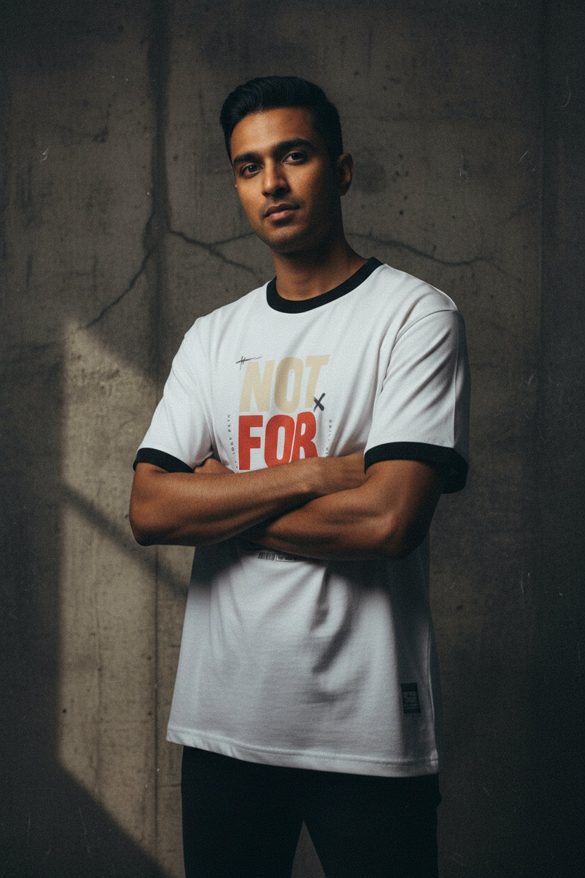 White t-shirt with colorful text design on a white background