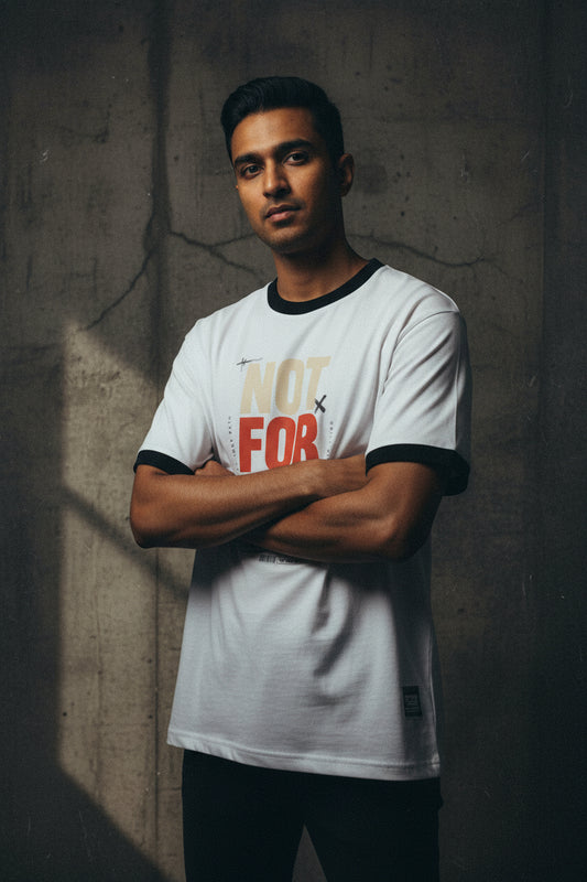 White t-shirt with colorful text design on a white background
